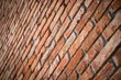 © kviktor - Red brick wall texture grunge background in perspective view. Selective focus
