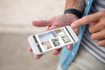 Poster - Composite image of interior of house on mobile screen