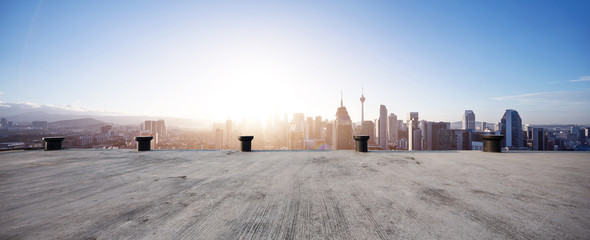 Poster - empty concrete floor with cityscape of modern city