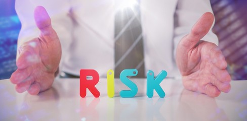Poster - Composite image of mid section of businessman with colorful risk
