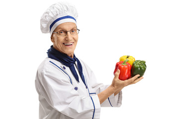 Wall Mural - Elderly chef with peppers