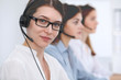 © rogerphoto - Call center operator.Young beautiful business woman in headset