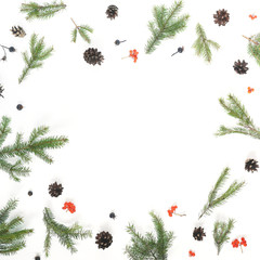 Wall Mural - Pattern of Christmas tree branches, cones on white background, top view. New Year, christmas background, frame. Flat design.