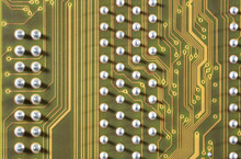 Close-up Of Electronic Circuit Golden Board Background Of Computer Motherboard.