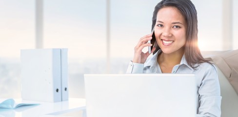 Poster - Composite image of smiling businesswoman phoning at the desk