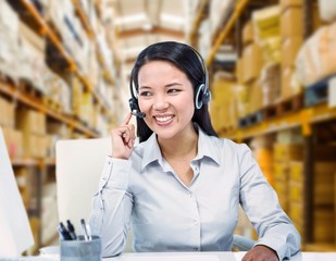 Poster - Composite image of smiling businesswoman using headset
