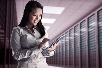 Poster - Composite image of smiling businesswoman using tablet