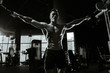© antondotsenko - Brutal Caucasian bodybuilder training chest in gym