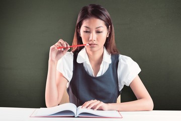 Poster - Composite image of thoughtful businesswoman reading