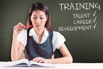 Poster - Composite image of thoughtful businesswoman reading