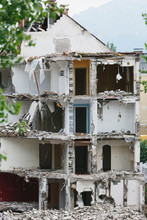 Partially Demolished Building Surrounded By Rubble