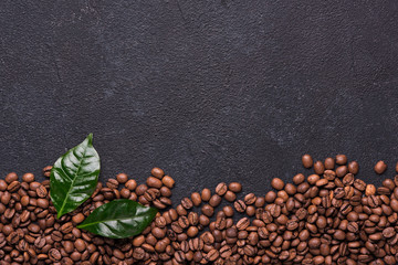 Wall Mural - Coffe beans with coffe leaves on black background