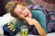 © Alexander - pregnant woman eating pickles in bed