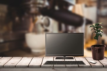 Poster - Composite image of a computer over a desk 