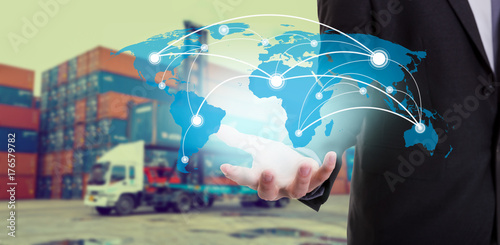 Cuadros en Lienzo Global network coverage world map on hand of businessman ,Industrial Container C