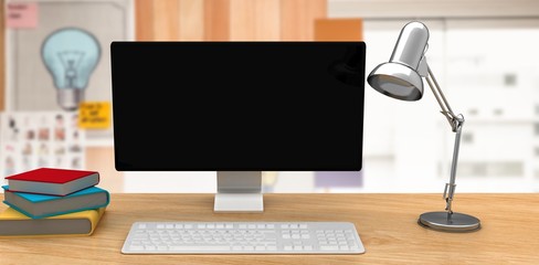 Poster - Composite image of a computer over a desk 