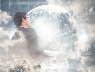 Poster - composite image of businessman looking up holding laptop