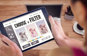 Poster - Composite image of woman using tablet pc