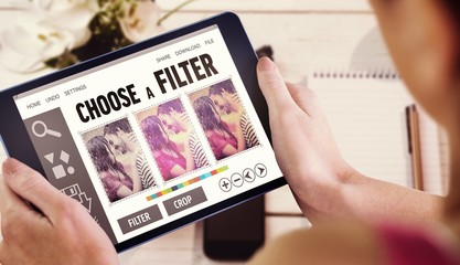 Poster - Composite image of woman using tablet pc