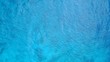 P02679 Aerial flying drone view of Maldives white sandy beach abstract waves water surface texture on sunny tropical paradise island with aqua blue sky sea ocean 4k