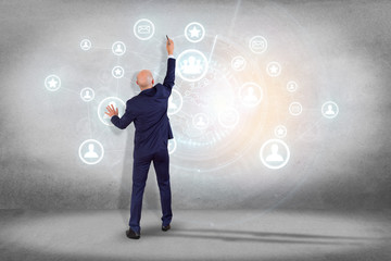 Poster - businessman in front of a wall writing on an international network globe connection - technology and