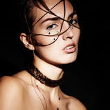 Creative unusual fashion hairstyle, sad girl on a black background