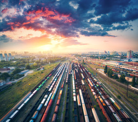 Wall Mural - aerial view of colorful freight trains. railway station. wagons with goods on railroad. cargo trains