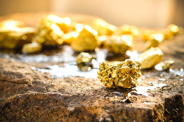 Wall Mural - The pure gold ore found in the mine on a stone floor