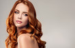 Leinwandbild Motiv Beautiful model girl with long red curly hair .Red head . Care and beauty hair products  