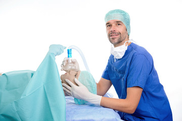 Wall Mural - young anesthetist with oxygen mask and patient