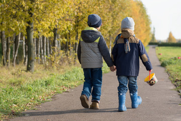 Friends walking along the path holding hands