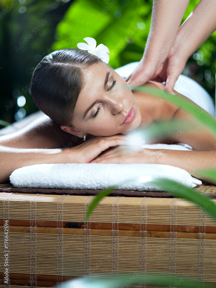 portrait of young beautiful woman in spa environment.  
