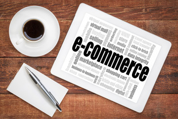 Wall Mural - e-commerce word cloud on tablet