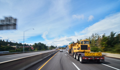 Wall Mural - large freight truck on highway with oversize load