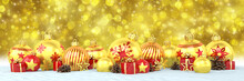 Many Golden And Red Christmas Baubles And Christmas Decorations Over Blue Bokeh Background - Panorama - Merry Christmas Concept