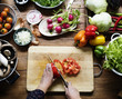 © Rawpixel.com - A person slicing vegetables