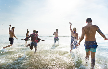 Wall Mural - Friends running in the water