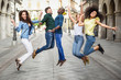 © javiindy - Group of friends jumping together outdoors