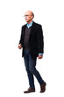 © F8  \ Suport Ukraine - Full length profile shot of a casual senior man walking and smiling isolated on white background