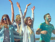 © Gorodenkoff - Multi-Ethnic Group of Diverse Young People Dancing in Celebration of Holi Festival. They Have Enormous Fun on this Sunny Day.