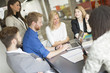© BGStock72 - Multiracial businesspeople having meeting in conference room.