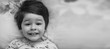 © alexkich - Black and white photo portrait of a young child lying on a pillow