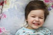 © alexkich - Portrait of a young child lying on a pillow