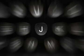 Fototapete - The letter of the alphabet in English J