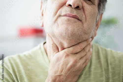 Cuadros en Lienzo Old man feeling painful in the throat