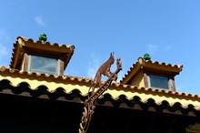 Weathervane On The Building In The Garden Of Laribal Of Barcelona.