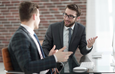 Manager talking with a colleague