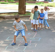 © Africa Studio - Little children playing hopscotch, outdoors