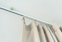 White Curtain Rail System With Light Brown Curtain
