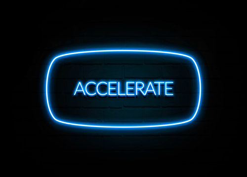 Accelerate  - colorful Neon Sign on brickwall
